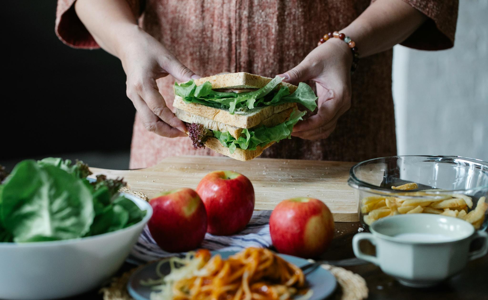 Never Run Out of Ideas: Top Tips for Generating Fresh Blog Topics Unrecognizable Female Standing At Table With Apples