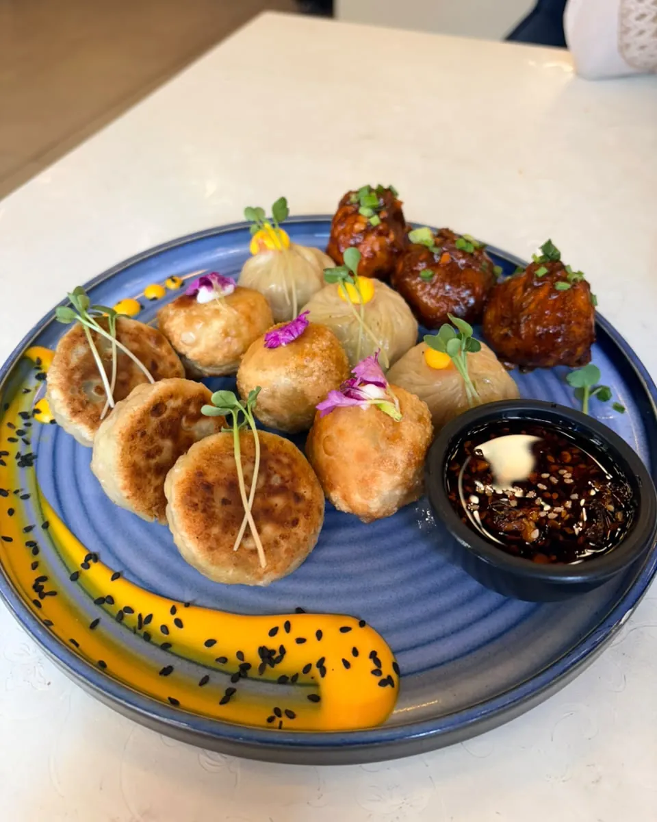 Assorted cafe snacks served on a blue sharing platter